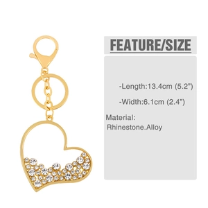Macro detail of heart keychain with rhinestones and size specifications on white background