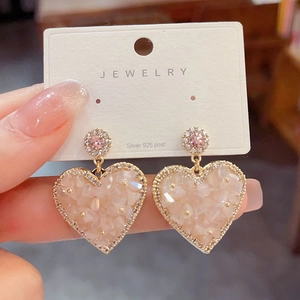 Sparkling pink heart earrings with crystal rhinestones on a Silver 925 post display card