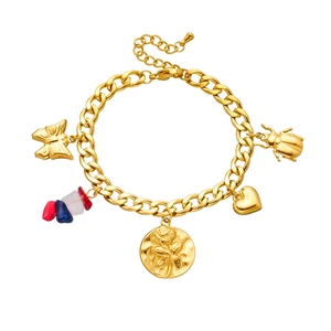 Detail of gold-plated chain bracelet with butterfly, rose, heart and beetle charms