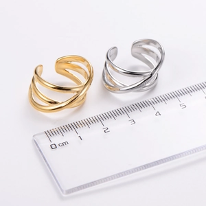 Close-up of gold and silver multi-layer rings with ruler showing 2cm width detail