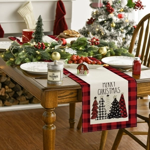 Detailed texture of Christmas table runner with buffalo plaid border and tree pattern