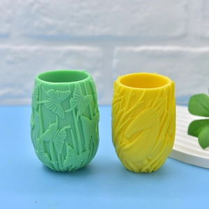 Green butterfly and yellow deer relief silicone molds with matte texture patterns