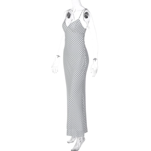 Detailed view of polka dot maxi dress with slim fit tailoring and spaghetti straps