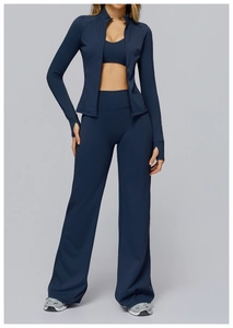 Detail view of navy blue yoga set featuring thumb hole cuffs and wide-leg flared pants