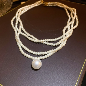Baroque multi-layer pearl necklace with triple strands and elegant large pearl pendant