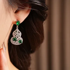 Retro hollow gourd-shaped earrings with green emerald zircons and white pearl accents