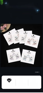 Detail view of 6 sets of multi-colored self-adhesive acrylic face jewels and eye gems