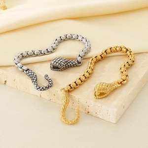 Chunky stainless steel Ouroboros snake link bracelet in gold and silver finish