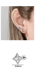 Detailed macro view of silver star stud earring with zircon and size 0.84cm display