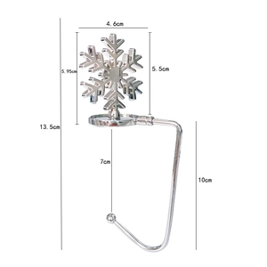Silver metal snowflake stocking hanger for fireplace mantel with detailed size dimensions