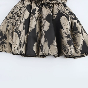 Elegant vintage black and gold jacquard long sleeve mini dress with a V-neckline