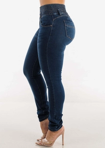 Detail view of high waist skinny jeans in dark blue denim with side profile slim fit