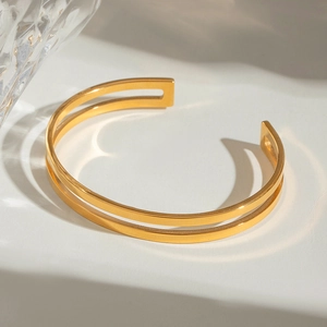Macro view of 18k gold plated stainless steel double layer open bangle bracelet