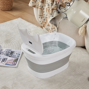 Collapsible foot bath tub with lid and water filling motion in cozy home setting