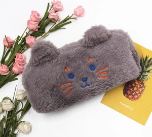 Detailed close-up of gray plush cat pencil case with 3D ears and embroidery
