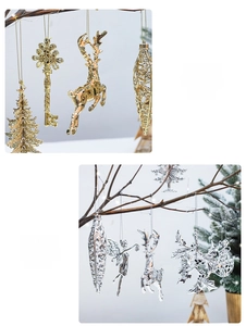 Detailed view of elegant gold and silver Christmas ornaments hanging on natural branches