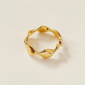 Detail of S925 hallmark on gold plated sterling silver irregular wavy textured ring