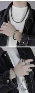 Close-up of double-layer titanium steel bracelet with OT buckle and necklaces on model