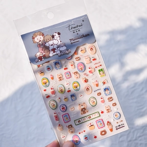 Detail view of Tomoni cartoon bear and dog nail art stickers with dessert illustrations