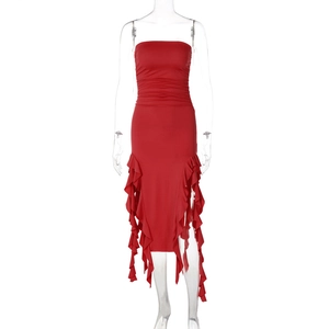 Detail view of red strapless dress featuring tiered ruffle hem and ruched waist details