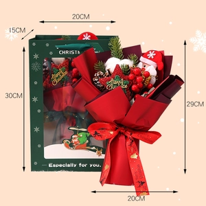 Christmas gift box set with floral bouquet and Santa doll in a festive green handbag carrier
