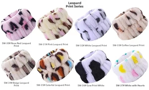 Detail view of thickened absorbent coral fleece wristbands in various animal print patterns