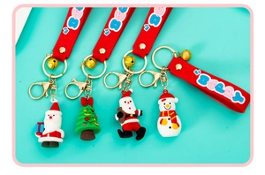 Detail view of 4 Christmas PVC keychains with Santa Claus, Snowman and Christmas Tree
