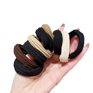 10pcs high elasticity ribbed hair ties in earthy tones held against white background
