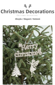 Close-up of glitter Merry Christmas lettering and tree pendants hanging on a pine branch