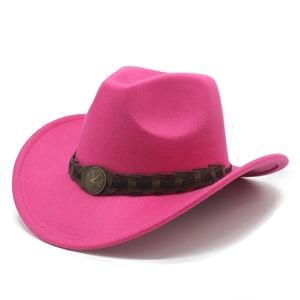 Detail of rose pink felt cowboy hat with braided leather band and star metal buckle