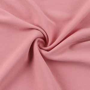 Detail shot of soft pink mesh fabric showing smooth texture and elegant drape quality