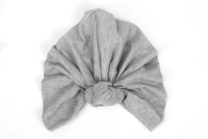 Detailed close-up of light grey knotted headwrap showing soft stretch knit fabric texture