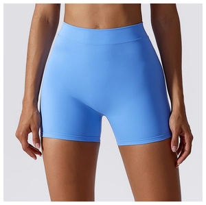 Detail of high-waisted seamless light blue yoga shorts with wide elastic waistband