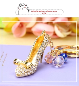Macro view of crystal high heel keychain with gold bow and colorful faceted beads