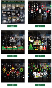 Detail of Christmas window stickers featuring Santa Claus, snowflakes and holiday scenes