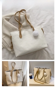 Detail of cream tote bag with cartoon bear embossing and khaki shoulder straps