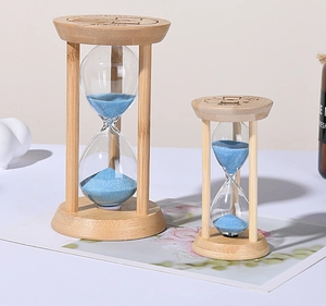 Detailed view of wood frame sand timer featuring blue sand in glass bulb ornaments