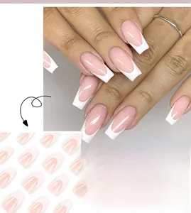 Detail of coffin-shaped French tip press-on nails in pale pink with white edges