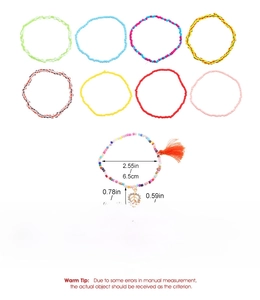 Detailed view of colorful beaded bracelets set with gold leaf charm and red tassel