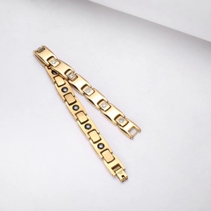 Close-up of gold stainless steel magnetic bracelet with cubic zirconia and gray magnets
