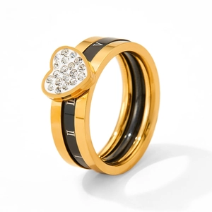 Detailed view of a gold heart ring featuring black Roman numeral inlay and white zircon