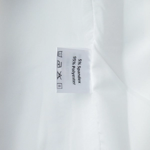 Detail shot of the care label showing 95% polyester and 5% spandex fabric composition