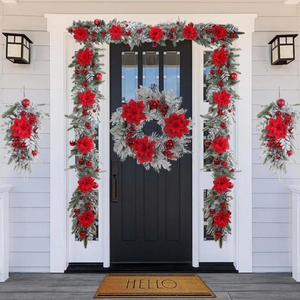 Dettaglio del set di ghirlande natalizie floccate con stelle di Natale rosse e palline