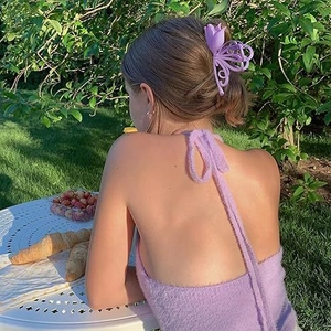 Outdoor model wearing a 11cm matte purple tulip and butterfly claw clip hair accessory