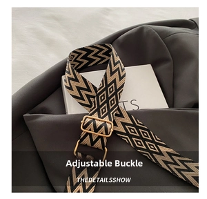 Close-up of woven shoulder strap with geometric patterns and golden adjustment buckle
