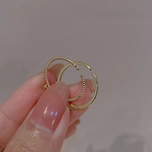Exquisite golden heart zircon stacking ring set with polished and twisted metal textures
