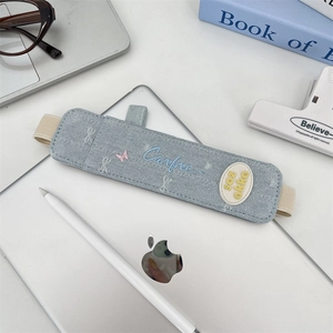 Detail view of denim elastic stylus holder with butterfly embroidery for tablets