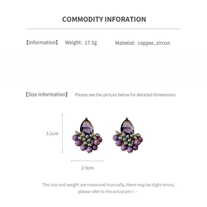 Detail shot of purple beaded teardrop earrings with dimensions 3.2cm x 2.9cm