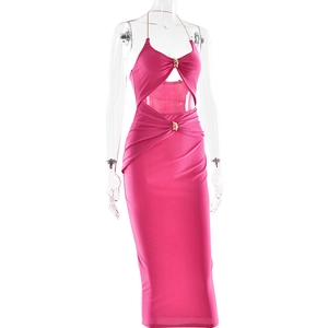 Detail view of the rose red halter dress featuring gold chains and metal ring cutouts