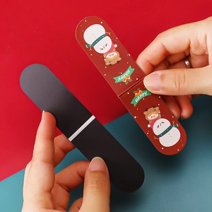 Cute Christmas magnetic bookmark with cartoon snowman and girl on red background